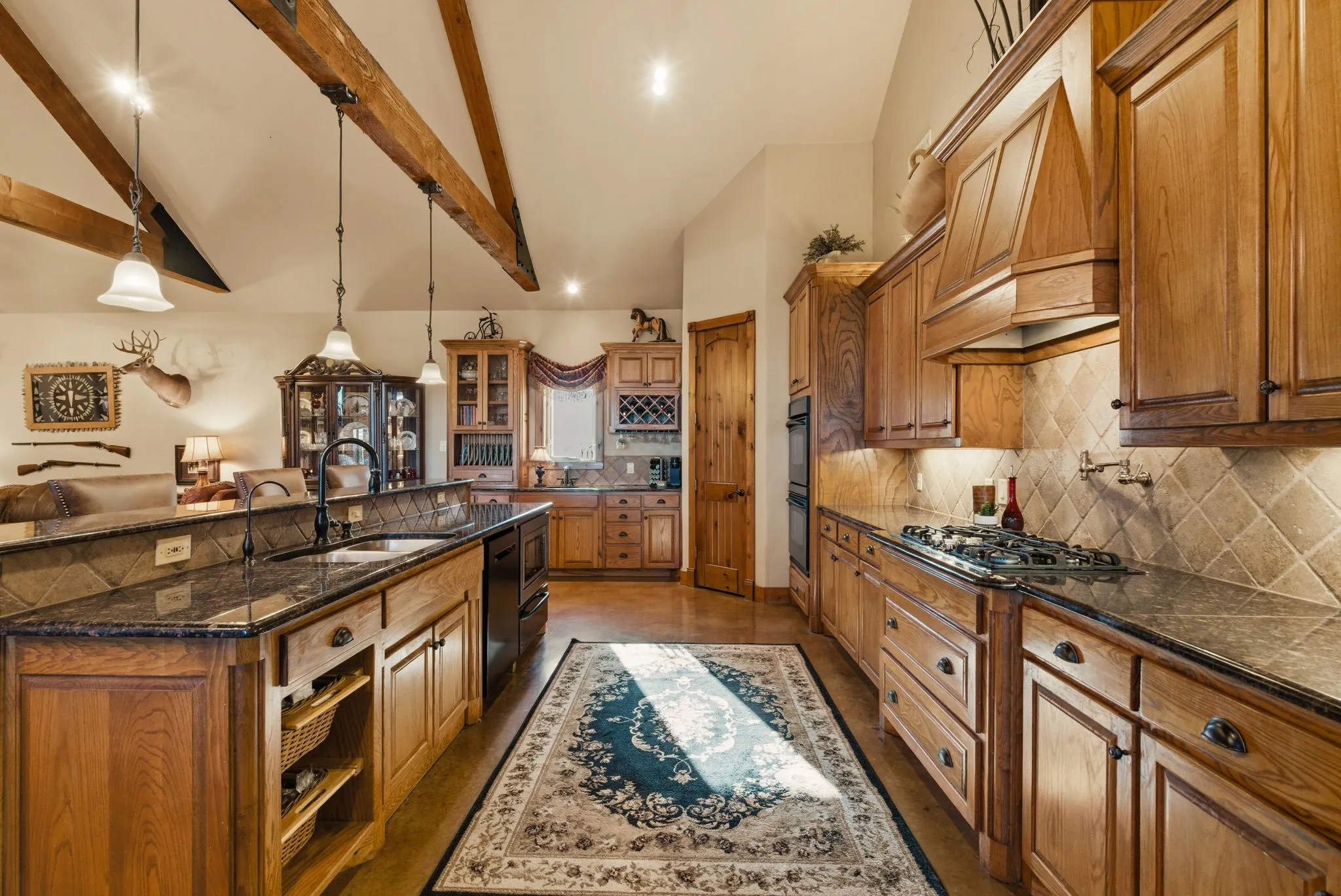 Kitchen with oversized island and wet bar