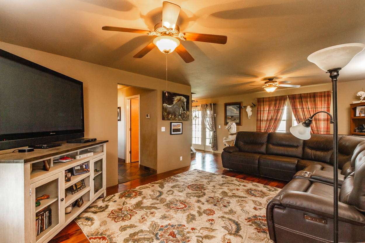 Living room with Spanish tile and hardwood floors