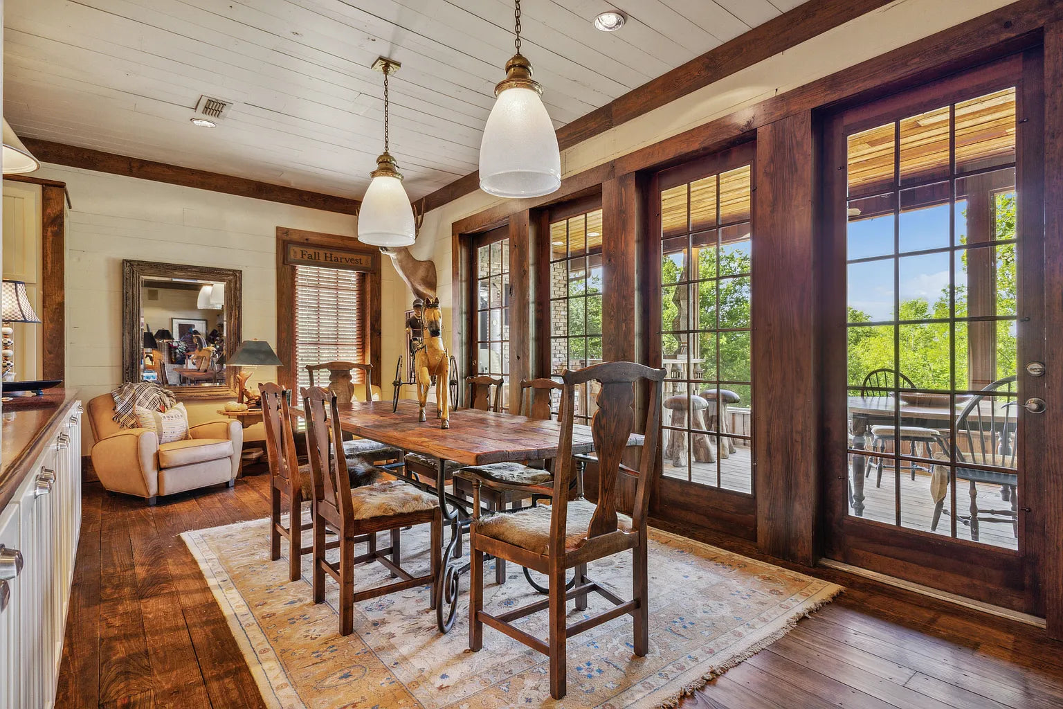 Sunlit breakfast nook with views of the gardens and oak canopy