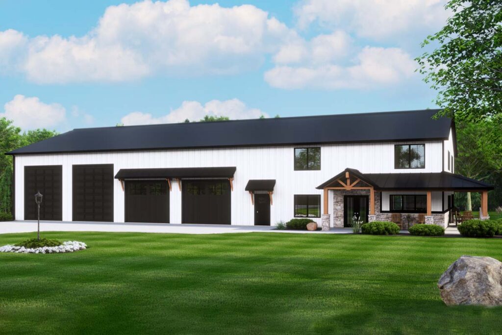 Two-story barndominium with farmhouse style, covered porch, three garage bays and black roof
