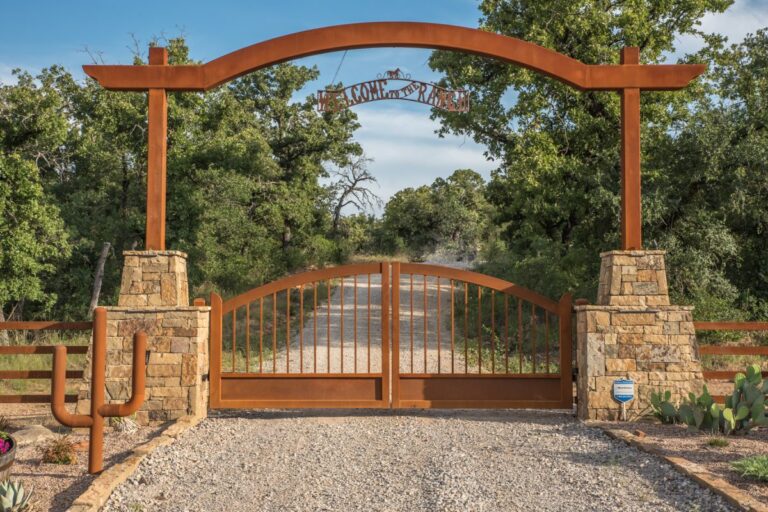 Arched steel ranch entrance by Aberdeen Custom Gate & Iron