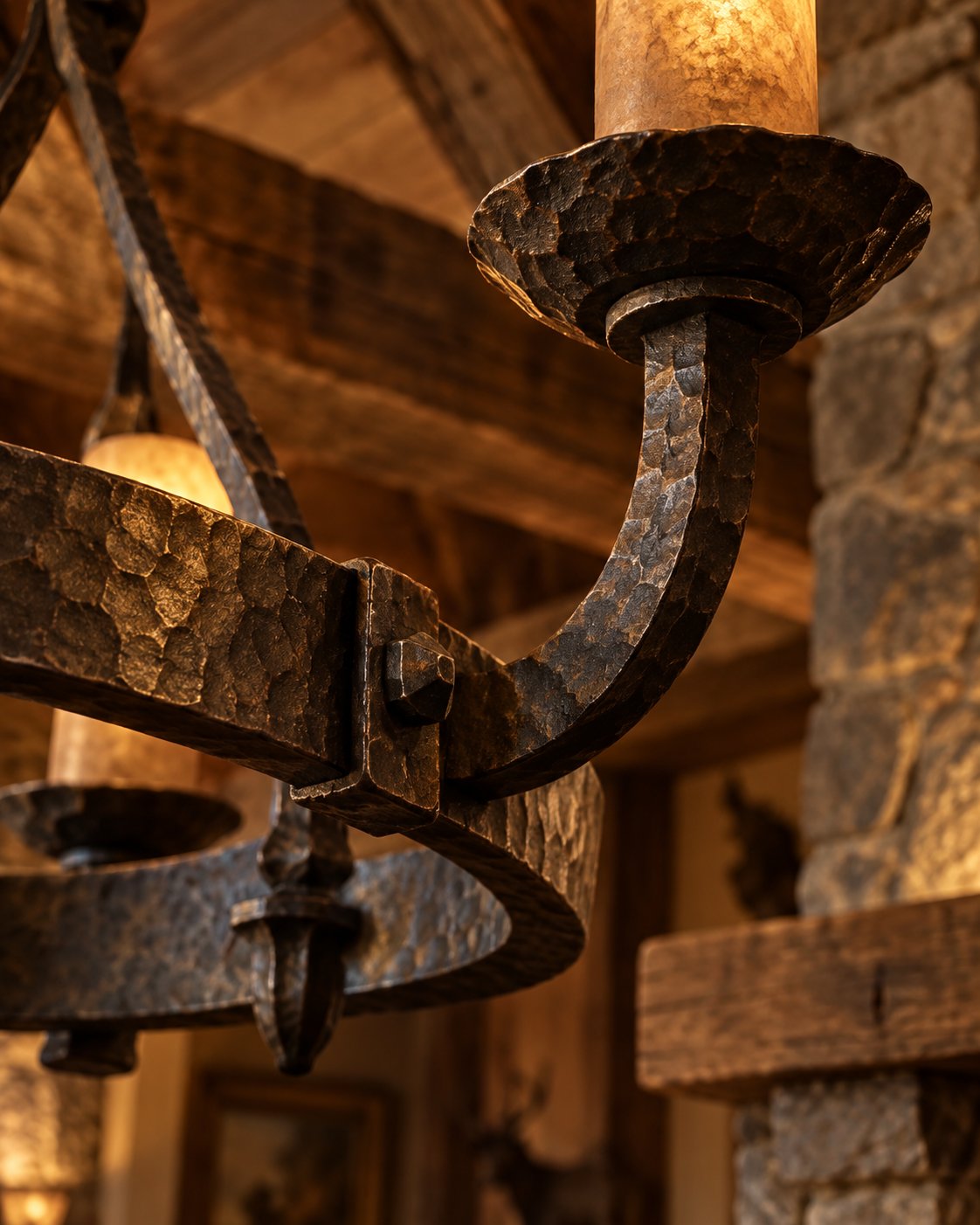 Hand-forged iron chandelier detail in a rustic ranch interior