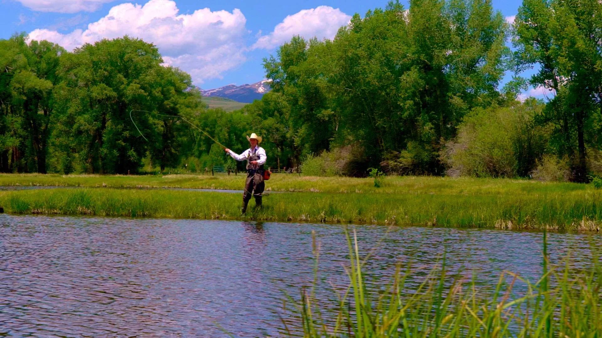 Fly fishing the stocked trout pond at Eagle Ridge Ranch