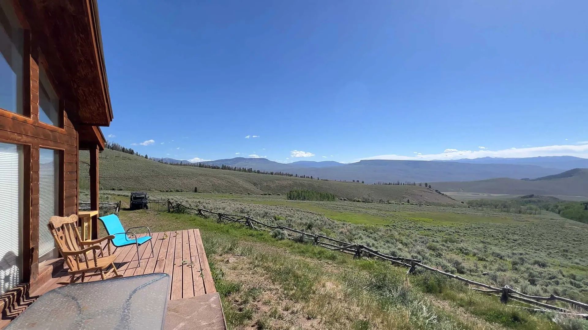 View across the valley from a wilderness cabin porch at Eagle Ridge Ranch
