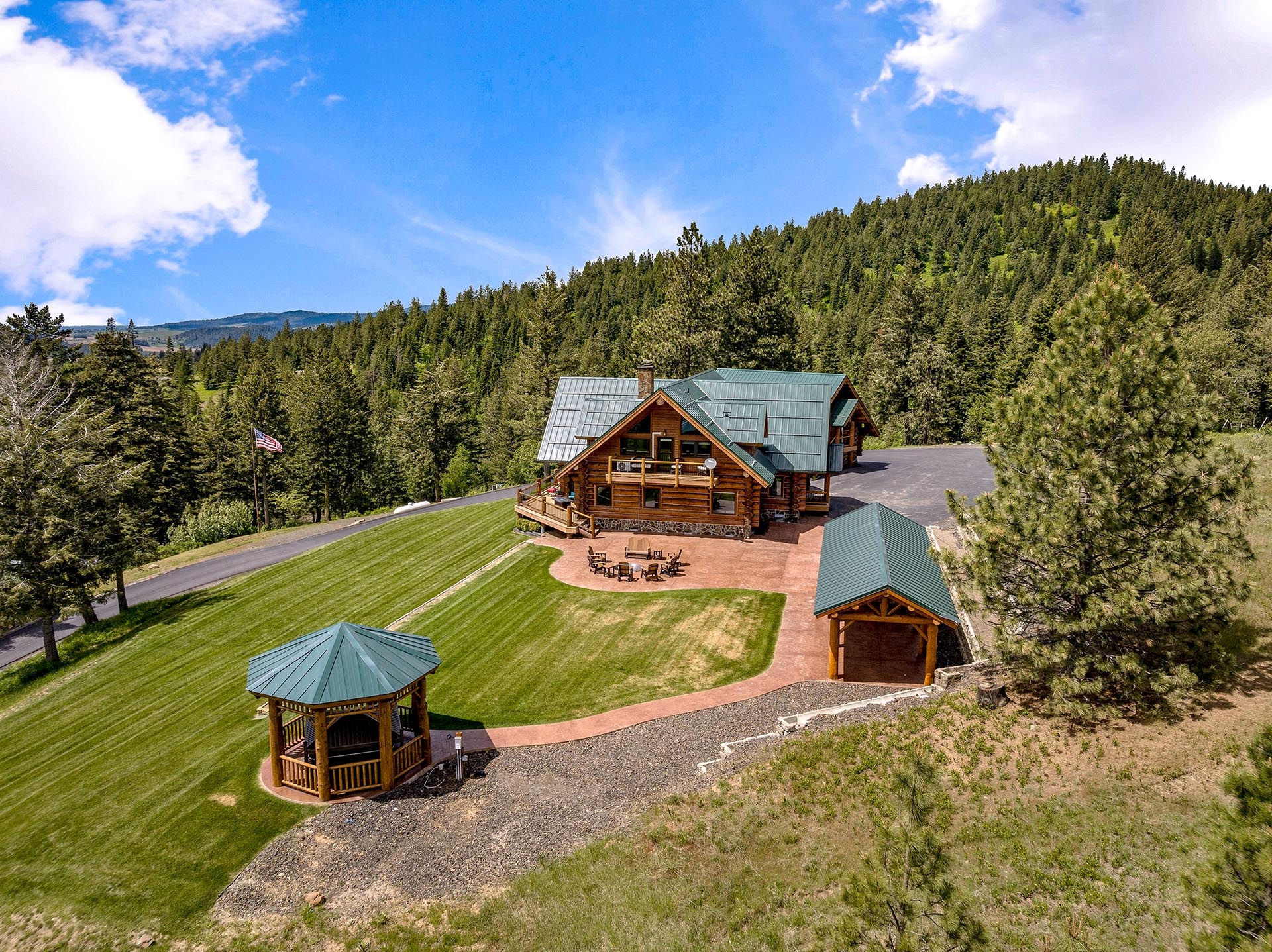 Elevated view of the Painted Rose Ranch log home and grounds in north Idaho