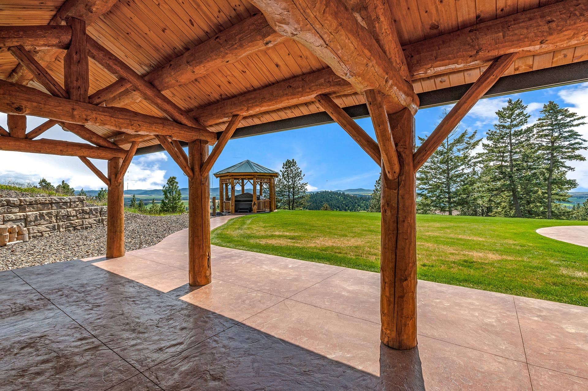 Custom log gazebo with valley views at Painted Rose Ranch