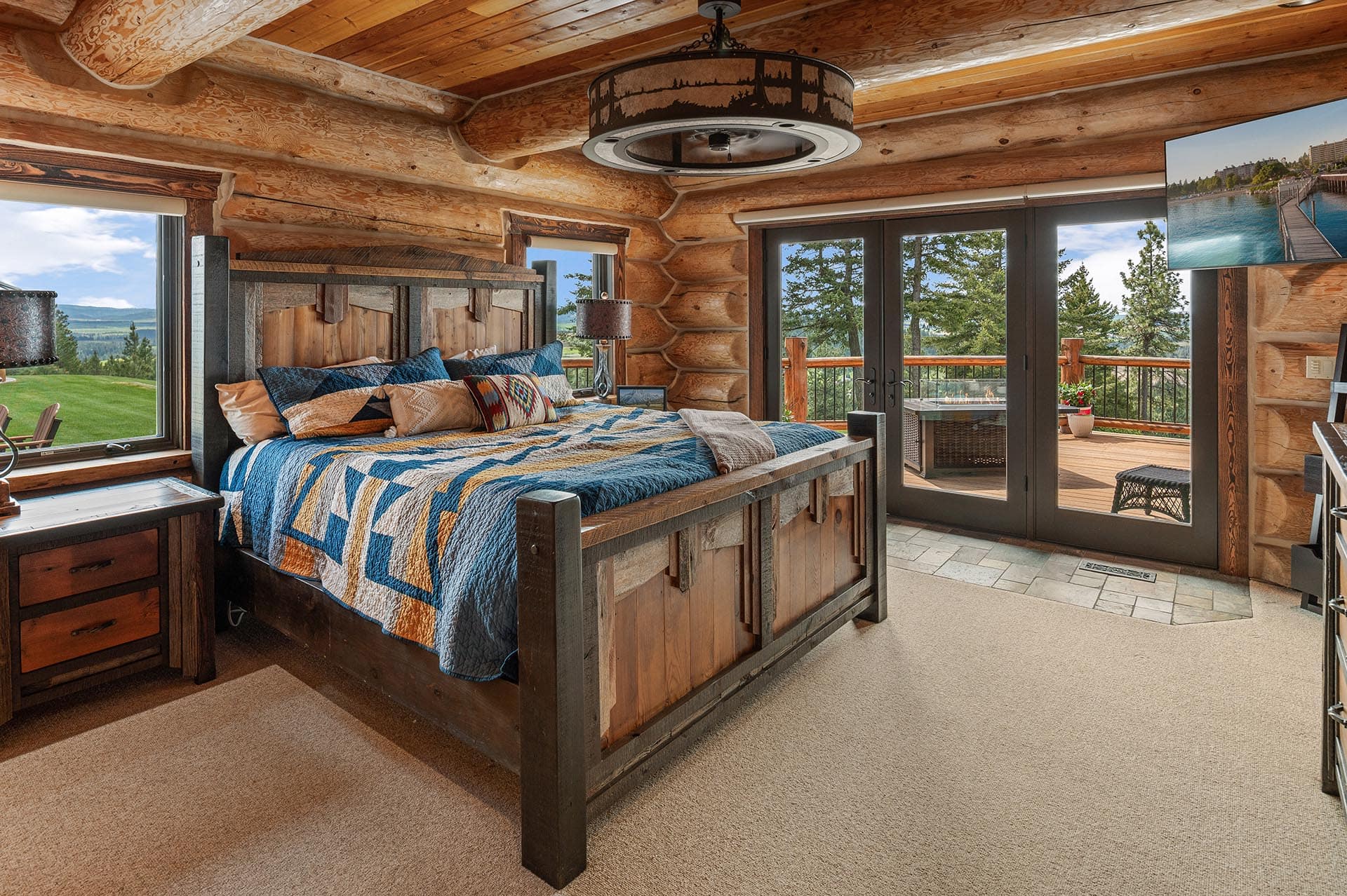 Primary bedroom in the Painted Rose Ranch log home
