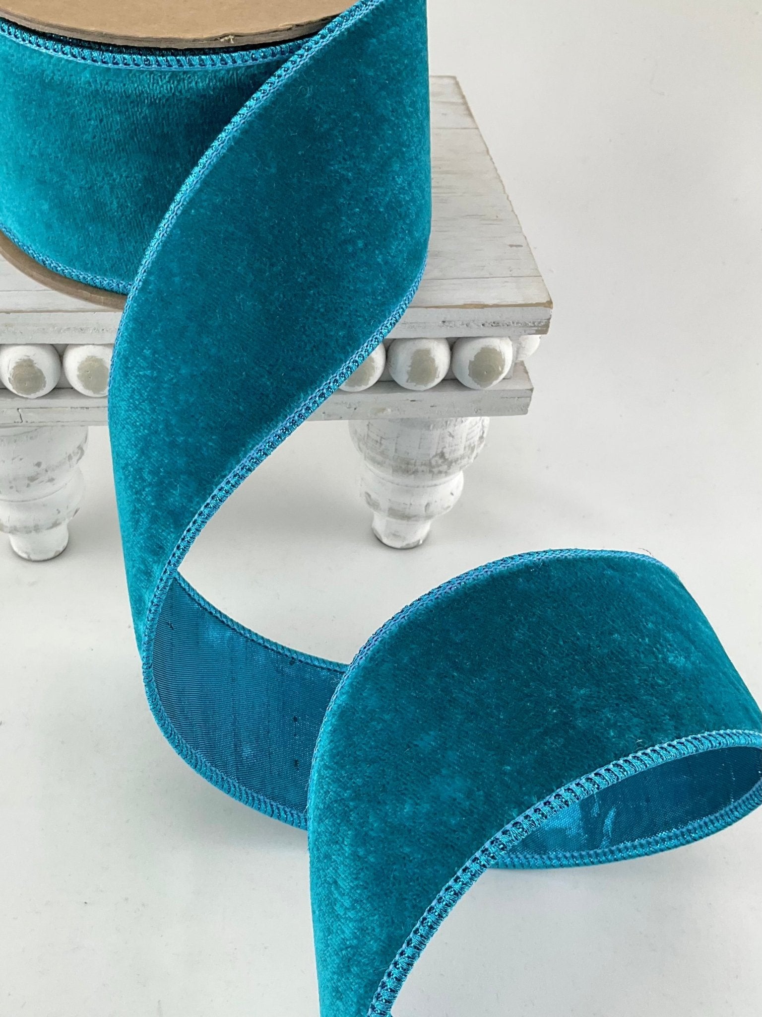Roll of deep teal wired velvet ribbon