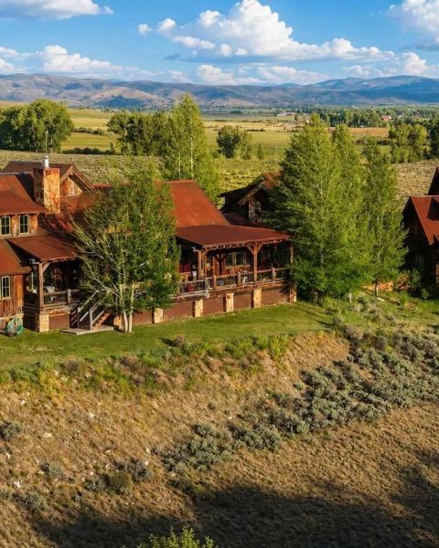 Timber and stone mountain home at Eagle Ridge Ranch Homestead #2 with the mountains beyond, Gunnison, Colorado